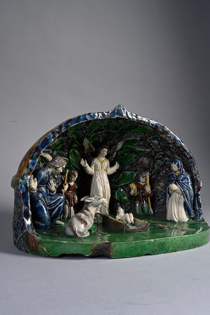 null Rare terracotta crib with lead glaze. Under a construction representing an open...