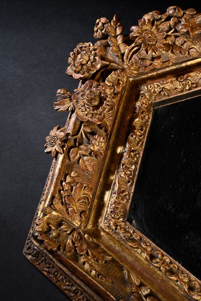 null Louis XIV mirror, hexagonal form, carved and gilded wood with decoration of...