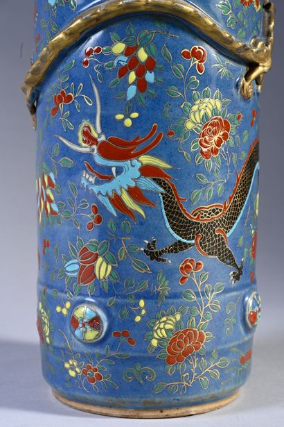 null Pair of porcelain hat stands on a blue background, decorated with a dragon in...