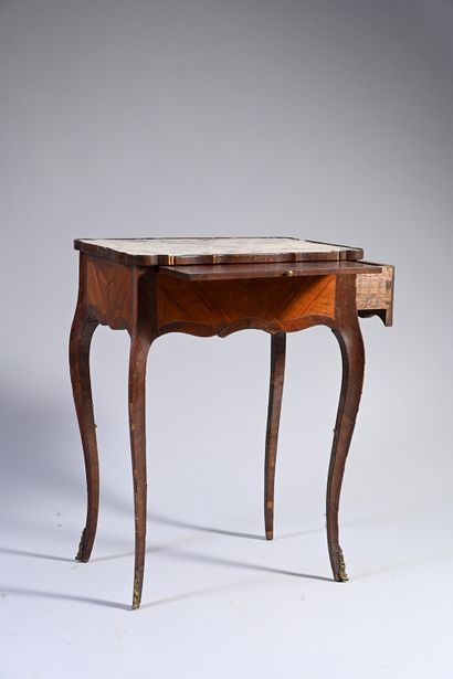 null Rosewood and amaranth table opening with a drawer in the belt and equipped with...