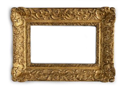 null Carved and gilded oak frame decorated with shells, foliage scrolls and flowers...