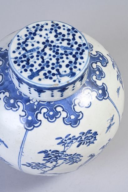 null Blue and white covered vase decorated with birds and butterflies on branch china....