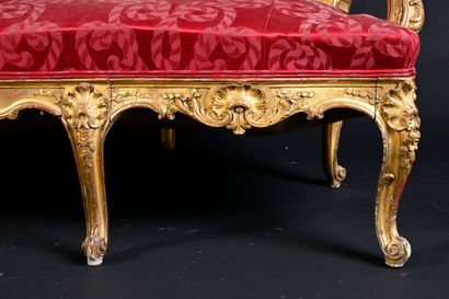 null Large molded, carved and gilded wooden sofa, the compartmentalized back with...