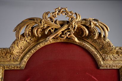 null Important and rare wooden frame richly carved and gilded with a curved form...
