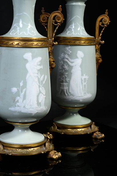 LIMOGES Pair of tripod oil lamps of loutrophore form in porcelain paste on white...