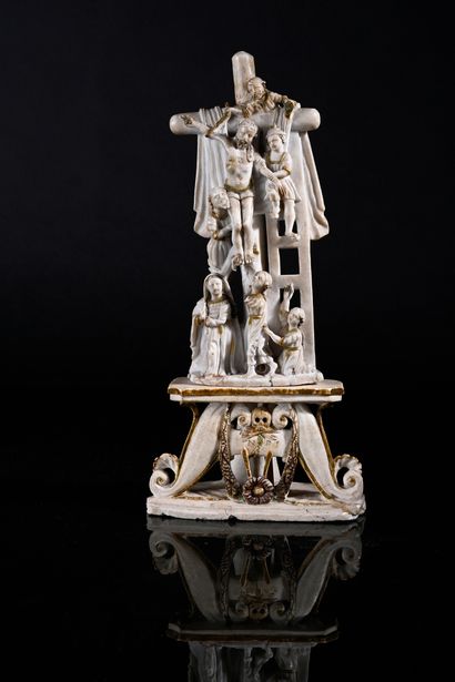 null Descent from the cross in alabaster carved with gold highlights; on a scroll...