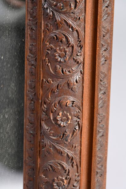 null Framed in carved Saint Lucia wood with foliage and flowers; scalloped frieze.
Eastern...