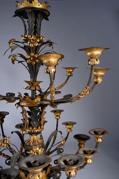null Large wrought iron and gilded sheet metal chandelier with 24 lights on two levels....
