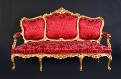 Large molded, carved and gilded wooden sofa,...