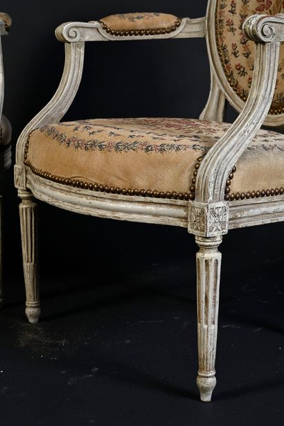 null Pair of armchairs with grey relacquered medallion backs, the armrests inverted...