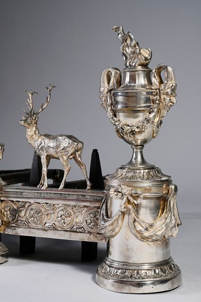 null Pair of important chased and re-silvered bonze andirons, adorned with two large...