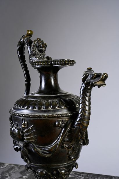 null Pair of ewers in chased bronze decorated with dragon, lion, crab and grotesque...