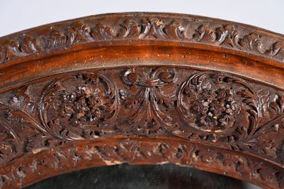null Framed in carved Saint Lucia wood with foliage and flowers; scalloped frieze.
Eastern...