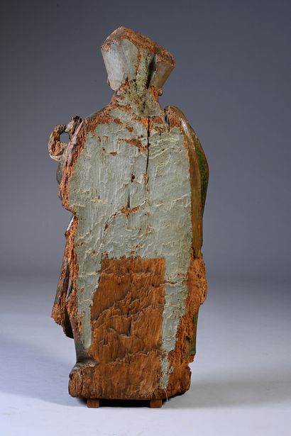 null Saint bishop in carved oak, polychromed, rough back. Standing, holding a crosier...