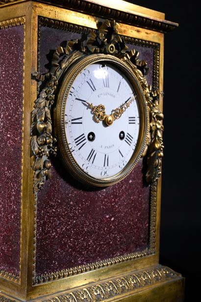 null Porphyry cage clock, the gilt bronze frame decorated with frieze of pearls and...