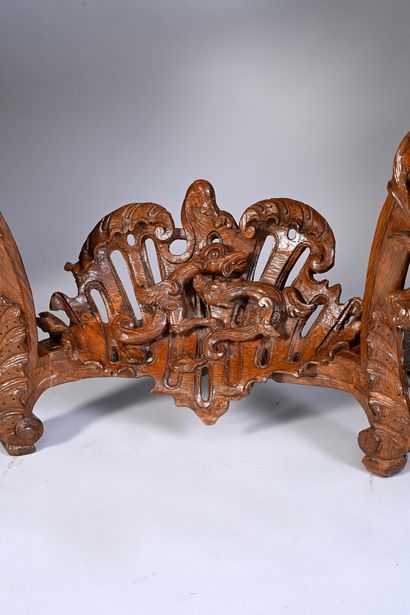 null Carved and openwork oak wall console, the crossbow belt decorated with large...