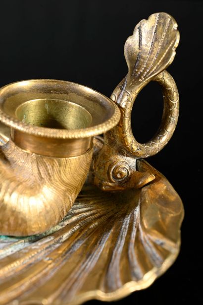 null Small chased and gilded bronze torch in the shape of a shell, the hold with...