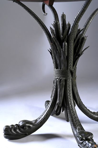 null Pedestal table with sea monsters and reeds in lacquered wood and mahogany veneer....