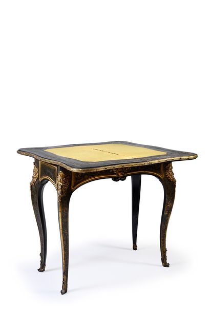 null Game table in marquetry of brown tortoiseshell, ebony and brass decorated with...