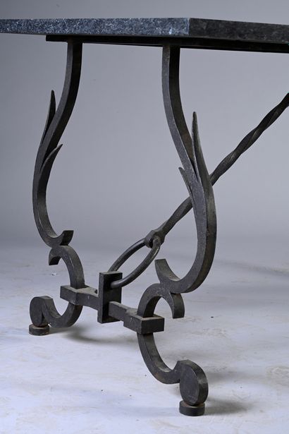 null Wrought iron middle table with a double scroll base joined by a spacer imitating...