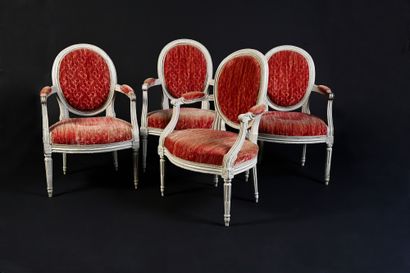 null Suite of four armchairs with white relacquered medallion backs, the armrests...