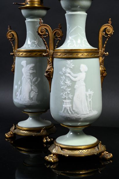 LIMOGES Pair of tripod oil lamps of loutrophore form in porcelain paste on white...