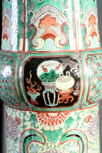 null Chinese porcelain GU vase decorated with enamels of the green family on a black...