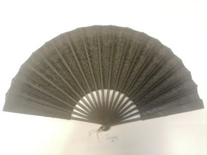 null Sequins, Europe, early 20th century 
Folded fan, the black fabric leaf embroidered...
