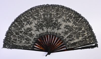 null Scrolls and bouquets, Europe, circa 1890 
Large folded fan, the leaf in black...