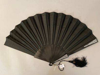 null 76 BIS
Clothes, circa 1890 
Folded fan, the black satin sheet painted with two...