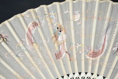 null Chinese dragon, China, 19th century
Folded fan, the silk leaf embroidered in...