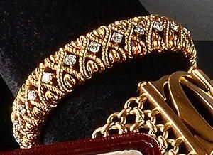 VAN CLEEF & ARPELS Bracelet ruban en or jaune cordé articulé de maillons entrecroisés,...