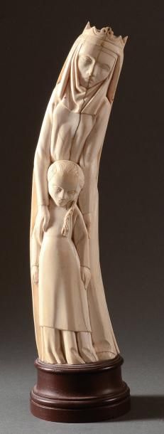 Jean FREOUR (1919-2010) Sainte Anne et la vierge. Taille directe sur ivoire (fentes)....