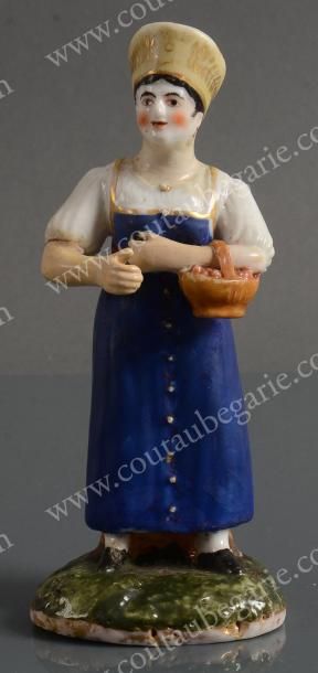 null Figurine en porcelaine tendre polychrome, représentant une cueilleuse de cerises,...