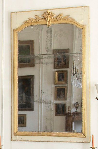 Miroir d'époque Louis XVI, à bordure en bois...