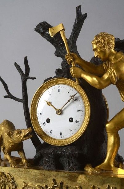 null PENDULE symbolisant «La chasse au loup», en bronze doré représentant un bûcheron...