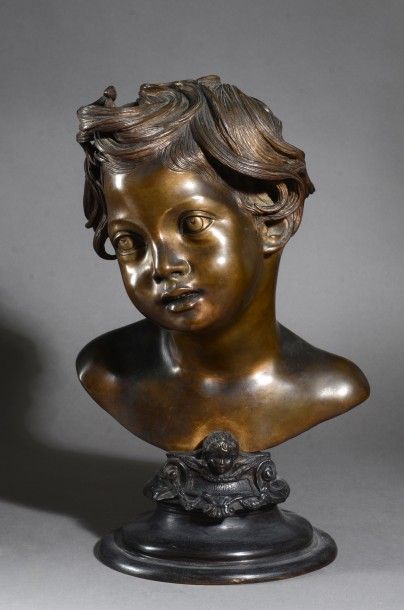 VINCENZO GEMITO (1852-1929) Tête d'enfant.
Bronze à patine or et brun nuancé.
Signé...