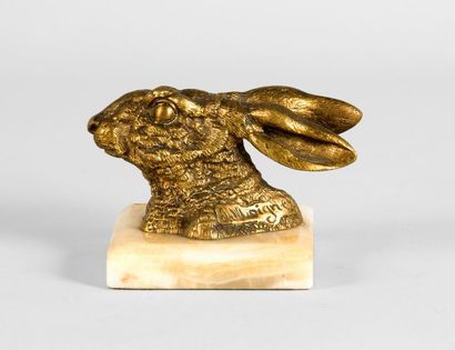 J.MOIGNEZ. «Tête de lièvre». Bronze à patine dorée signé en creux. Long. 10 cm. Socle...