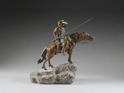 BAUER S. Cosaque à cheval, sur socle en granit. Bronze à patine verte et brune, nuancée,...