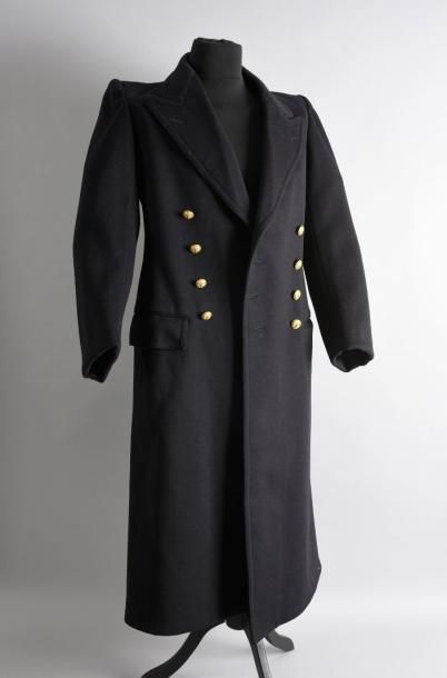 null Johnny Hallyday 1998
Grand manteau croisé en laine noire et boutons de marine...