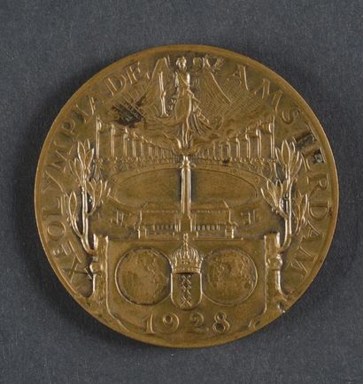 null 1928. Amsterdam. Médaille officielle de participant. Par Wienecke. En bronze.
Diam....