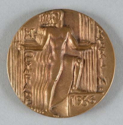 null 1936. Berlin. Médaille officielle de participant. Signée Otto Placzek. En bronze.
Diam....