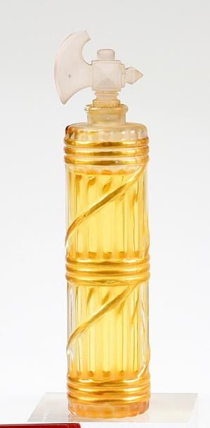 Parfumeur non identifié - (années 1920) Curieux flacon en verre incolore pressé moulé...