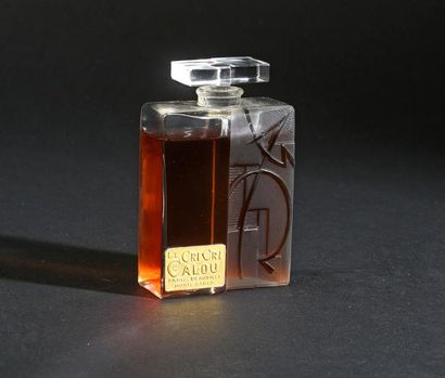 LE CRI CRI CALOU - (années 1930) Rare flacon moderniste en verre incolore pressé...