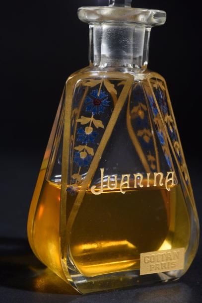COTTAN «Juanina» (années 1910)
Flacon en cristal incolore pressé moulé de section...