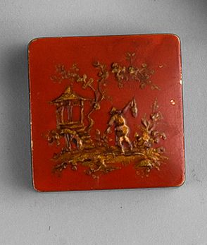 Bourjois (années 1920) 
Boitier de fard gras carré en métal laqué rouge corail illustré...