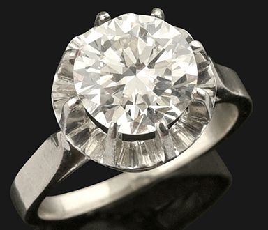 null Bague solitaire en or 750 et platine 850 millièmes, ornée d'un diamant brillanté...