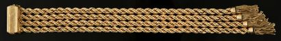 null Bracelet en or jaune 750 millièmes formé de quatre rangs d'une maille corde,...