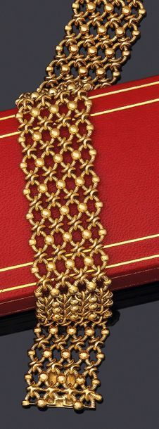 CARTIER 
Bracelet «résille» 4 rangs en or 750 millièmes à motifs alterné d'anneaux...
