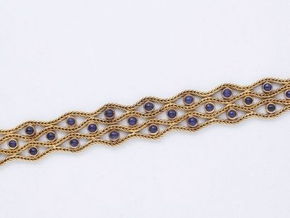 null Bracelet souple en or 750 millièmes à décor ajouré mouvementé composé de chaînes...